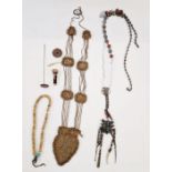 A metal chatelaine decorated with Japanese symbols, turquoise and other beads, a hatpin, beaded