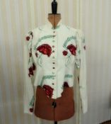 An Angela Holmes fitted cotton jacket with slight peplum bold carnation print on a white
