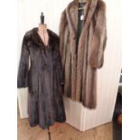 A full-length ranch mink coat labelled Maxwell Croft of London, and a full-length raccoon coat