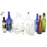 Assorted glassware to include two vintage baby feeding bottles marked 'Allenbuys', two carnival