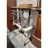 Two vintage metal base Singer sewing machine tables and two albums of sewing machine ephemera (4)