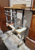 Two vintage metal base Singer sewing machine tables and two albums of sewing machine ephemera (4)