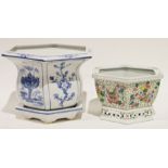 Blue and white planter with saucer and a Chinese-style planter decorated with butterflies and