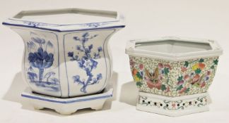 Blue and white planter with saucer and a Chinese-style planter decorated with butterflies and