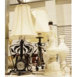 Wrought iron table lamp with clock, another wrought iron table lamp, an alabaster lamp, a marble