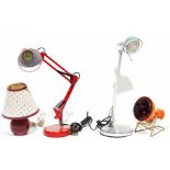 Orange anglepoise lamp, a stainless steel desk lamp, a Motion Feratherm Deluxe heater made in