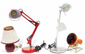 Orange anglepoise lamp, a stainless steel desk lamp, a Motion Feratherm Deluxe heater made in