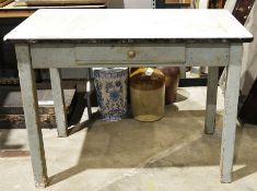Vintage kitchen table with a white enamel top, on wooden supports