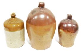 Three large earthenware flagons, one stamped 'Castle Edward & Co Bristol', another 'D Hoare' and