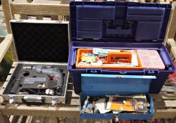 Two toolboxes containing some tools but mainly fixings and screws, a Bosch cordless sabre saw,