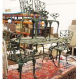 Painted metal Coalbrookdale-style garden table, oval with under-shelf, four chairs and a smaller