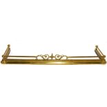 Adjustable brass fire curb with decorative scroll decoration to the centre