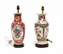 Two Oriental-style ceramic table lamps, both on wooden circular stands, 45cm and 43cm high (2)
