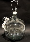 Oversized glass carboy fitted as a lamp