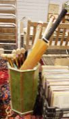 Four cricket b ats and four croquet mallets in octagonal painted wooden stickstand