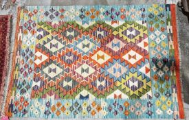 Chobi orange ground kilim with lozenge trelliswork and floral border, 155cm x 107cmCondition