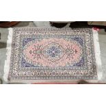 Turkish wool pink ground rug with floral medallion, floral spandrels and multiple floral borders