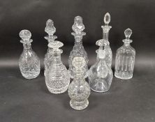Eight various cut glass engraved decanters, 19th century and later, including two facet cut examples