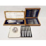 Set of six pairs of EPNS and mother-of-pearl handled fruit knives and forks, engraved blades, in oak