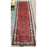 North west Persian red ground Malayer Runner with repeating lozenge and floral pattern, floral