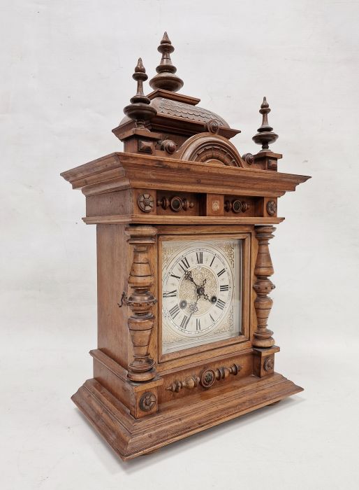 19th century oak cased Black Forest-style mantel clock, carved and moulded case with urn finials and