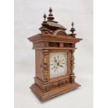 19th century oak cased Black Forest-style mantel clock, carved and moulded case with urn finials and