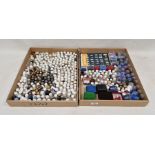 Large collection of ceramic and metal souvenir and commemorative thimbles and empty thimble domes
