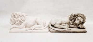 Two moulded composite stone figures depicting resting lions, each mounted on plinth bases, 44cm long