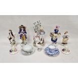 Group of Continental porcelain figures including a gentleman and companion each carrying baskets