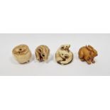 Japanese carved boxwood netsuke in the form of a rabbit, inscribed signature, 4.5cm long and three