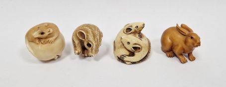 Japanese carved boxwood netsuke in the form of a rabbit, inscribed signature, 4.5cm long and three