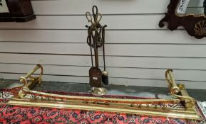 Brass fire curb with raised support to the front and twin handles, 134cm long approx. and a set of