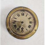 Small brass ship's bulkhead clock, brass face and black painted roman numerals, mounted on wooden