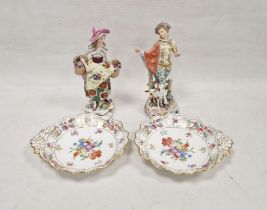 Two Continental porcelain figures, a German figure of a gallant with a hound (lacking left hand) and