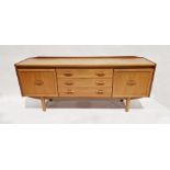 Mid century teak sideboard by William Lawrence comprising two single cupboard doors opening to