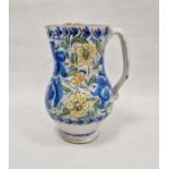 Continental faience baluster jug, 19th century, painted with scrolling blue foliage amongst yellow