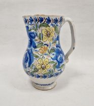 Continental faience baluster jug, 19th century, painted with scrolling blue foliage amongst yellow