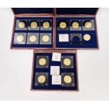 Collection of 1/200oz Windsor Mint gold coins, housed in three wooden display boxes, to include