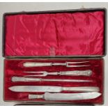 Cased Victorian silver-handled carving set, three pieces, crested handles (one handle broken),
