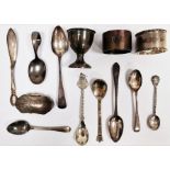 Silver eggcup, intiialled 'I.J.K', two silver napkin rings, assorted teaspoons, souvenir spoons,