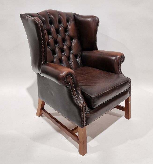 Pair of brown leatherette button upholstered Georgian-style armchairs with outscroll arms,