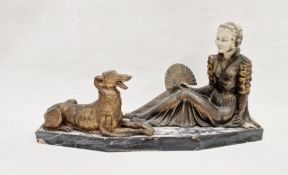 Art Deco figure group depicting a seated lady in period dress, beside a dog, the lady holding a hand