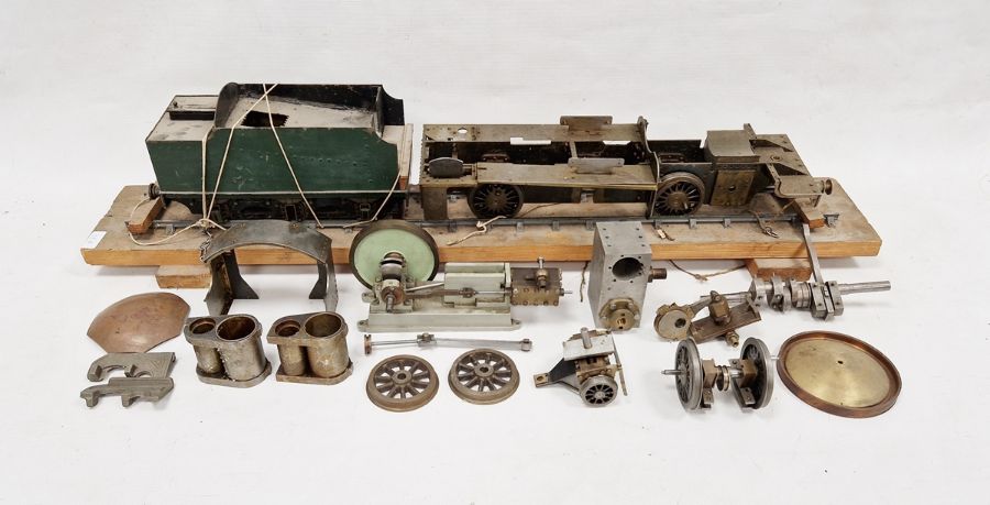 Part-built model steam engine (82cm x 12cm x 14cm) on track platform together with loose bits to