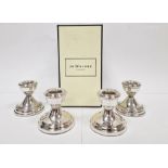 Pair of silver-filled squat candlesticks, Birmingham 1990, 6.5cm high and a pair of 1970's silver-