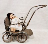 Vintage 1950's metal doll's pram, 66cm high including handle and a Pedigree doll (2)