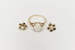 18ct gold and white opal cabochon ring, 2g approx. and a pair of gold and opal flower-shaped stud