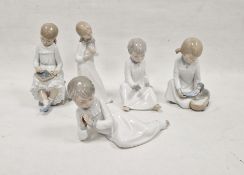 Five Nao figures of children, 20th century printed brown marks incised symbols and numerals, each