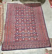 Eastern blue ground rug with floral and geometric field, multiple floral and single geometric