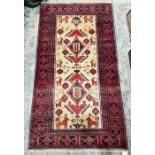 North east Persian meshed cream rug Belouch rug with two central stepped geometric medallions on