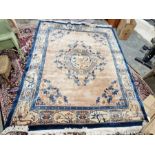 Large cream ground Chinese superwash carpet with centralised floral medallion enclosed by floral